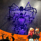 Halloween-dekoration med svart spindel och ljus