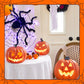 Halloween-dekoration med svart spindel och ljus