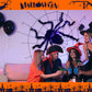 Halloween-dekoration med svart spindel och ljus