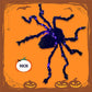 Halloween-dekoration med svart spindel och ljus